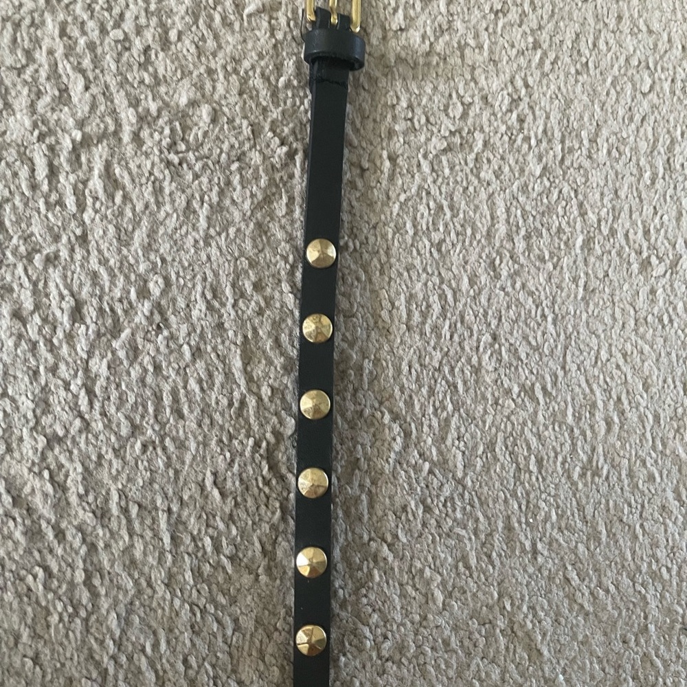 Black belt with gold studs. Please see measuring tape photo for exact inches.